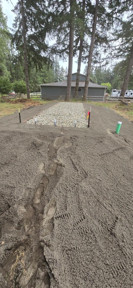 Completed drain field with gravel bed at residential property